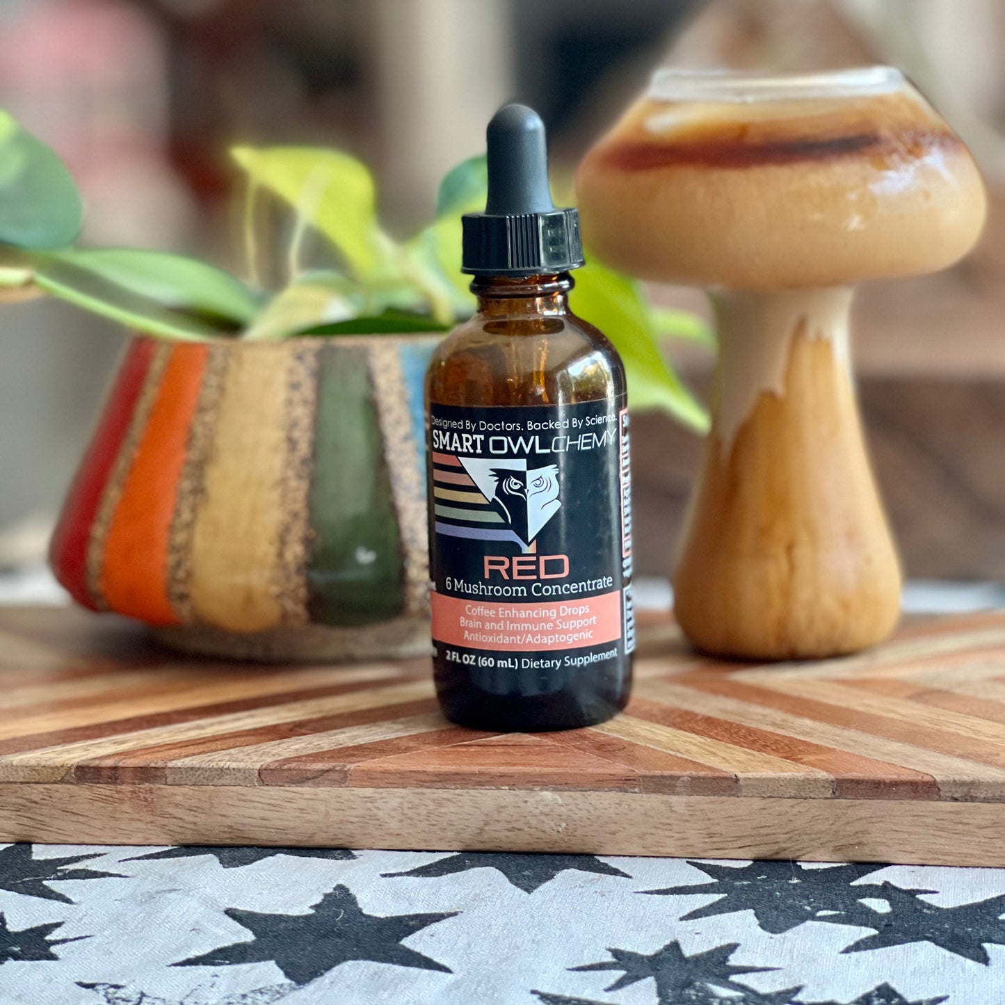 Red Drops Smart Owlchemy mushroom extract supplement drop in a small glass bottle with dropper, designed for health support.
