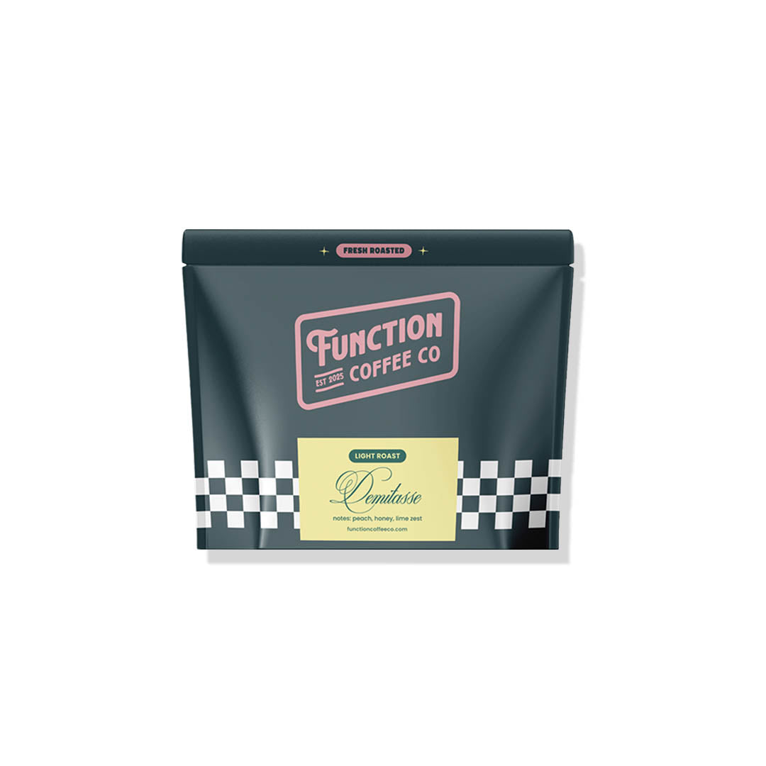 Sample of demitasse-sized coffee from Function Coffee Co's The Founder's Sampler Ultimate Coffee Bundle Box, showcasing rich coffee varieties.