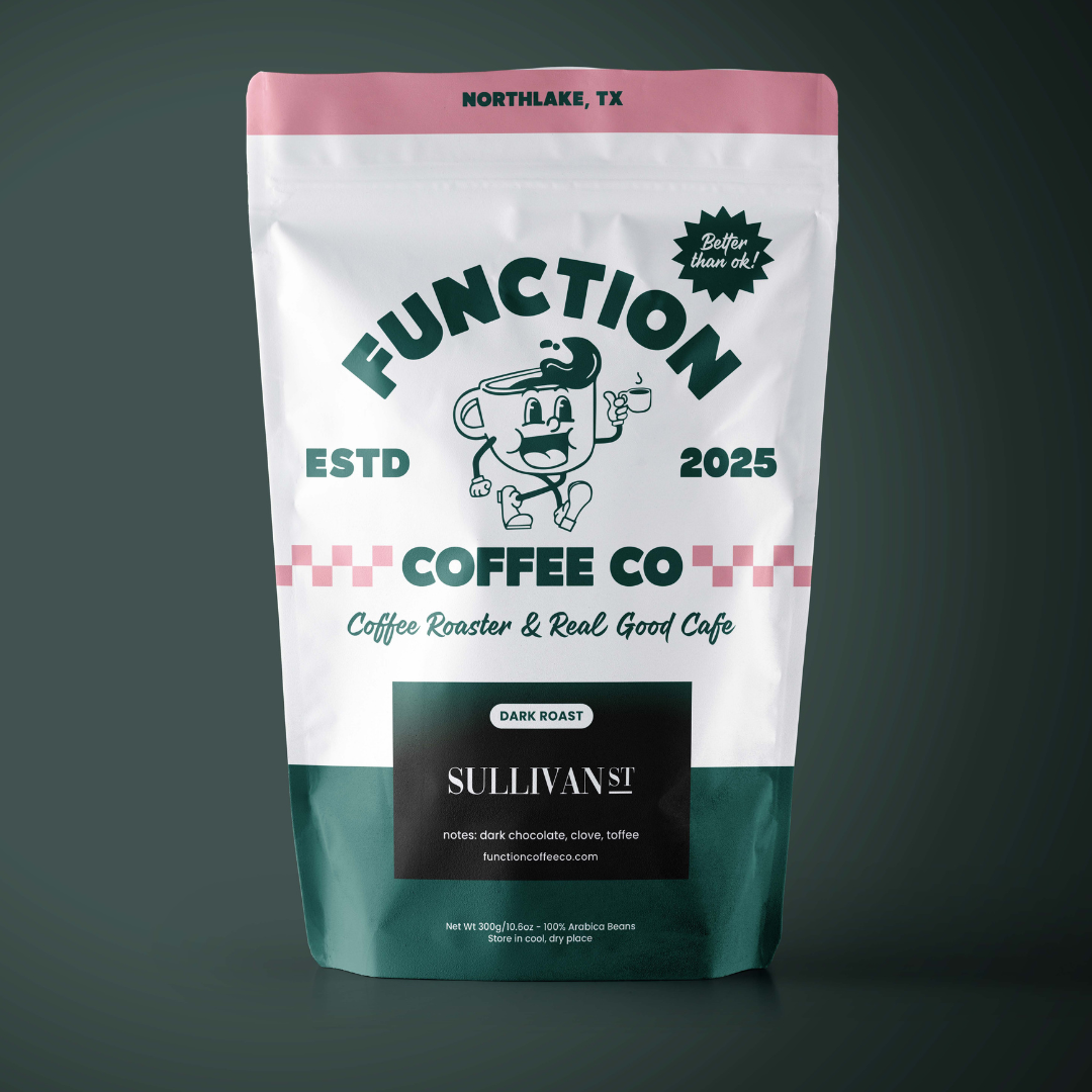 Dark roast coffee beans from Sullivan St by Function Coffee Co, showcasing rich, roasted coffee beans in a natural setting.