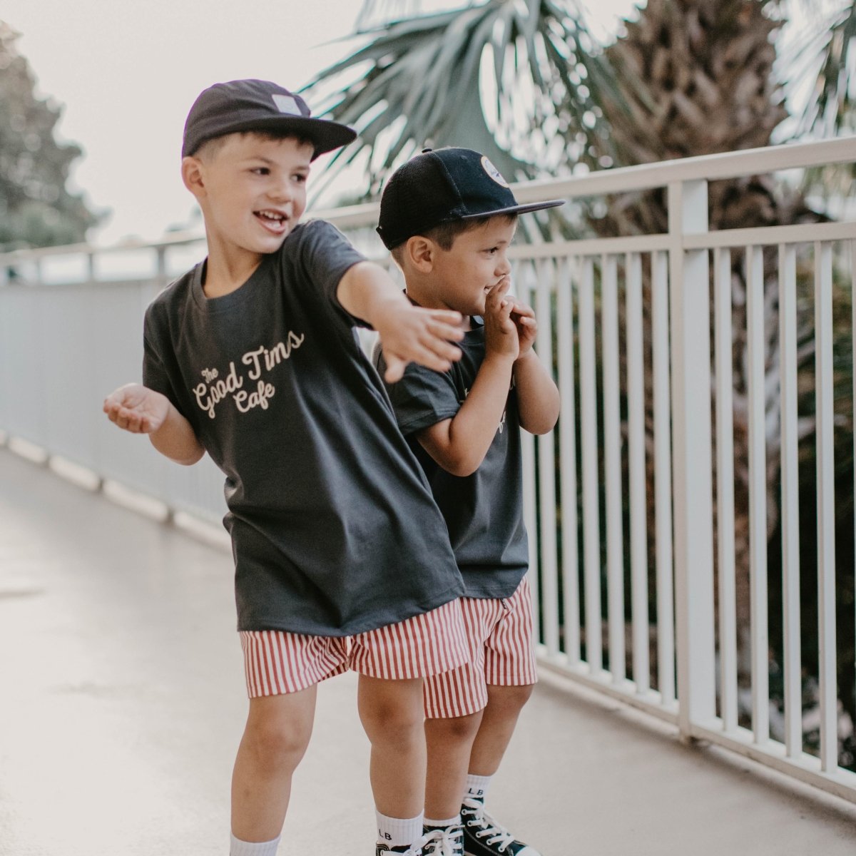 Baby and toddler coal-colored T-shirt from LITTLE RAD THINGS featuring "The Good Times Cafe" design.