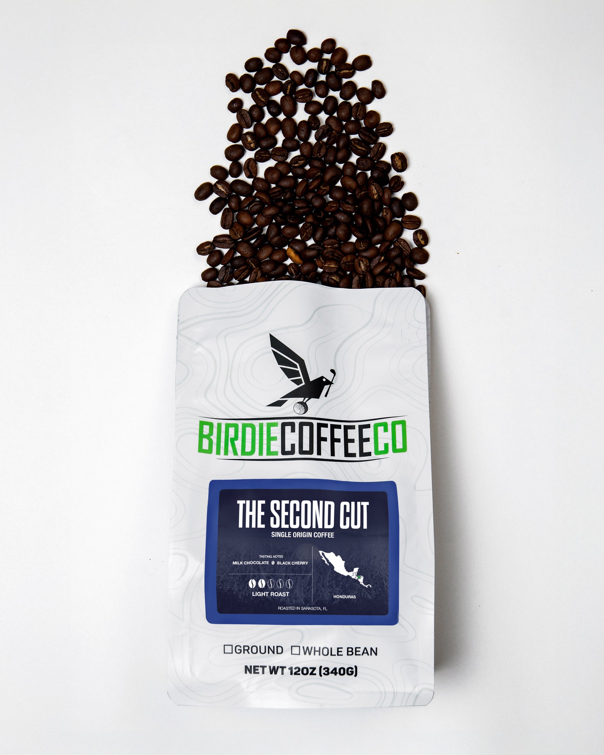 Light roast coffee beans from Birdie Coffee Company's The Second Cut, showcasing a close-up of roasted coffee beans.