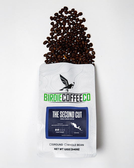 Light roast coffee beans from Birdie Coffee Company's The Second Cut, showcasing a close-up of roasted coffee beans.